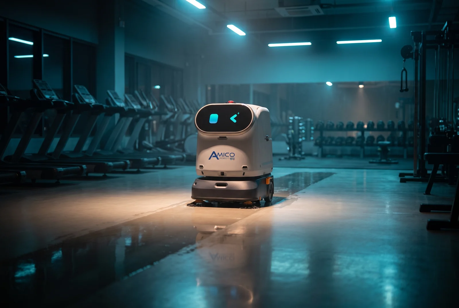 Il ZCS Amico Robot C40 lava i pavimenti di notte in una palestra vuota